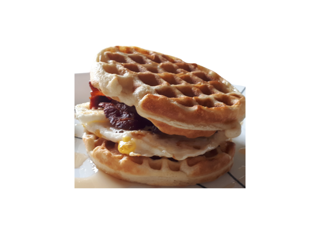 Breakfast sandwich with waffle, bacon and egg.